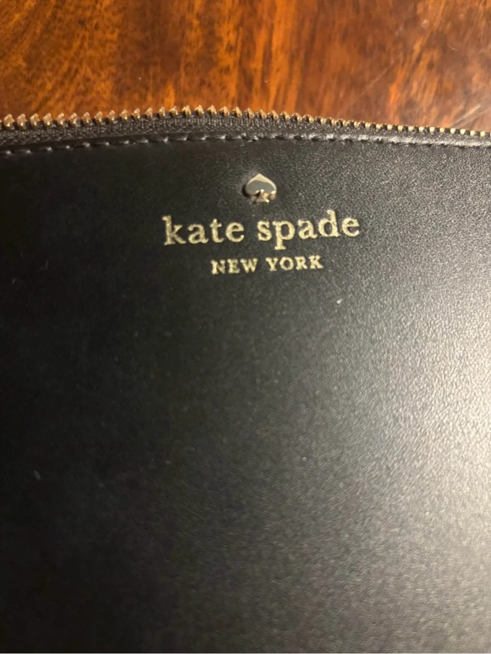 Kate Spade Black Leather Crossbody Bag with Tassel Accent